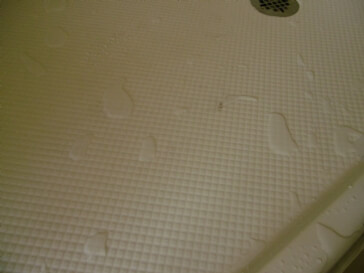 Pooling of water in shower pan